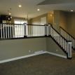 Custom alder & painted handrail built by Langston Carpentry